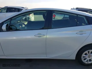 2021 Toyota Prius L Eco with VIN JTDKAMFU7M3133544, listed as a IAAI auction lot 41548653 with 115,214 mi miles. Bid and sale history available at carsss.com. Image 15.