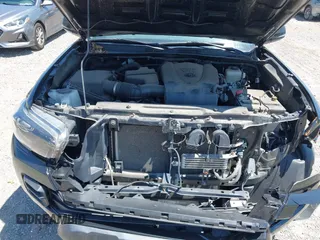 2019 Toyota Tacoma SR with VIN 5TFCZ5AN4KX208354, listed as a IAAI auction lot 42771410 with 77,509 mi miles and . Bid and sale history available at DreamBid. Image 10.