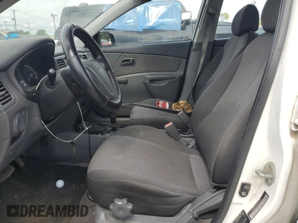 2009 Kia Rio LX with VIN KNADE223996526222, listed as a Copart auction lot 69976484 with 318,702 mi miles and Salvage Title. Bid and sale history available at DreamBid. Image 7.