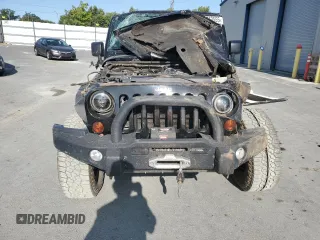 2012 Jeep Wrangler Unlimited Sahara with VIN 1C4BJWEG5CL235835, listed as a Copart auction lot 60673555 with 86,606 mi miles and Salvage title. Bid and sale history available at DreamBid. Image 5.