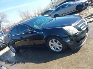 2009 Cadillac CTS AWD z VIN 1G6DH577290166448, wystawiony jako IAAI lot #41751610 z przebiegiem 158 378 mil mil oraz . Historia ofert i sprzedaży dostępna na DreamBid. Obrazek 13.