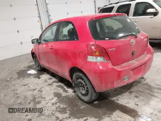 2009 Toyota Yaris with VIN JTDJT903695262292, listed as a IAAI auction lot 41636204 with 157,986 mi miles. Bid and sale history available at carsss.com. Image 3.