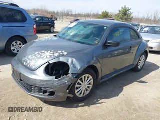 2012 Volkswagen Beetle Entry PZEV with VIN 3VWFP7AT7CM644732, listed as a IAAI auction lot 41864458 with 134,073 mi miles. Bid and sale history available at carsss.com. Image 2.