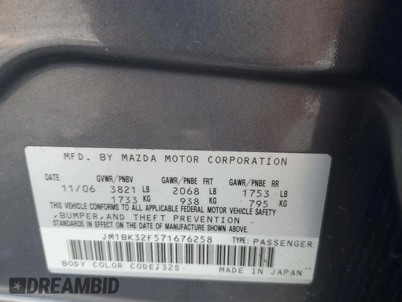 2007 Mazda 3 i Touring with VIN JM1BK32F571676258, listed as a Copart auction lot 87883545 with 141,203 mi miles and Salvage Title. Bid and sale history available at DreamBid. Image 12.