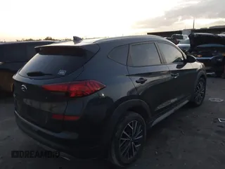 2019 Hyundai Tucson Sport with VIN KM8J33AL7KU901296, listed as a IAAI auction lot 41132884 with 76,948 mi miles. Bid and sale history available at carsss.com. Image 4.