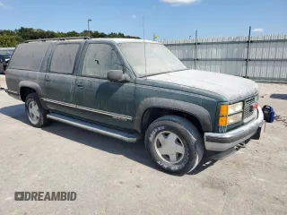 1998 GMC Suburban z VIN 3GKFK16R1WG511256, wystawiony jako Copart lot #77568484 z przebiegiem 301 116 mil mil oraz Czysty tytuł • Clean title. Historia ofert i sprzedaży dostępna na DreamBid. Obrazek 4.