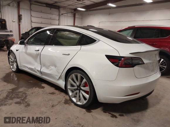 2018 Tesla Model 3 Long Range Battery with VIN 5YJ3E1EB5JF084446, listed as a IAAI auction lot 41209852 with 70,125 mi miles and . Bid and sale history available at DreamBid. Image 3.