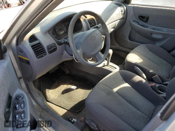 2005 Hyundai Accent GLS with VIN KMHCG45C75U638812, listed as a Copart auction lot 77968234 with 130,815 mi miles and Salvage Title. Bid and sale history available at carsss.com. Image 8.