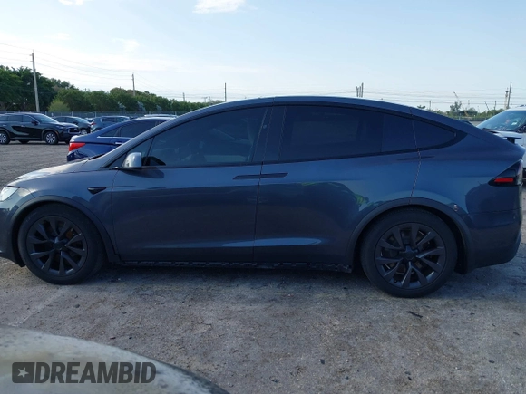 2022 Tesla Model X with VIN 7SAXCDE54NF342256, listed as a IAAI auction lot 41991212 with 28,740 mi miles and . Bid and sale history available at DreamBid. Image 14.