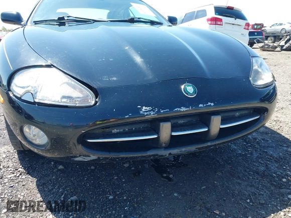 2002 Jaguar XK with VIN SAJDA42C12NA30499, listed as a IAAI auction lot 41954577 with 77,152 mi miles and . Bid and sale history available at DreamBid. Image 12.