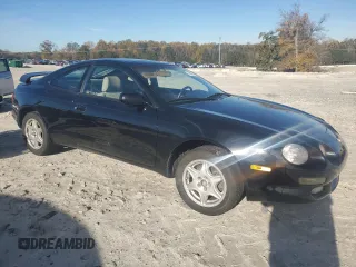 1997 Toyota Celica GT with VIN JT2DG02TXV0040610, listed as a Copart auction lot 79677454 with 179,749 mi miles and Salvage Title. Bid and sale history available at carsss.com. Image 4.