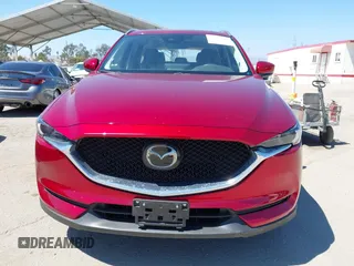 2021 Mazda CX-5 Grand Touring with VIN JM3KFADM5M0470483, listed as a IAAI auction lot 42785031 with 30,749 mi miles and . Bid and sale history available at DreamBid. Image 12.