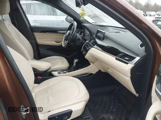 2016 BMW X1 xDrive28i with VIN WBXHT3C31GP881488, listed as a IAAI auction lot 41693116 with 120,922 mi miles. Bid and sale history available at carsss.com. Image 5.