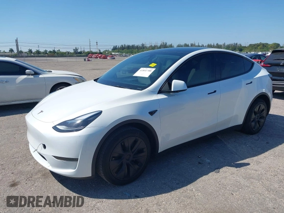 2024 Tesla Model Y with VIN 7SAYGDED9RF161420, listed as a IAAI auction lot 41892788 with 12,353 mi miles and . Bid and sale history available at DreamBid. Image 2.