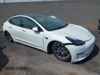 2021 Tesla Model 3 Standard Range Plus z VIN 5YJ3E1EA6MF048339, wystawiony jako IAAI lot #40442012 z przebiegiem Nie podano mil oraz . Historia ofert i sprzedaży dostępna na DreamBid. Obrazek 1.