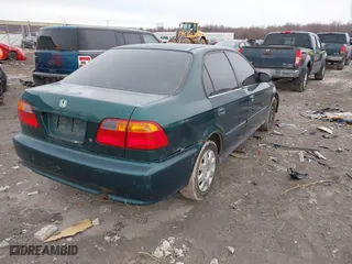 1999 Honda Civic VP with VIN 2HGEJ6617XH537283, listed as a IAAI auction lot 41483084 with 153,655 mi miles. Bid and sale history available at carsss.com. Image 4.