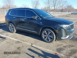 2022 Cadillac XT6 Premium Luxury with VIN 1GYKPDRS5NZ122060, listed as a IAAI auction lot 41584678 with 36,036 mi miles. Bid and sale history available at carsss.com. Image 1.