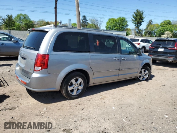 2013 Dodge Grand Caravan SXT with VIN 2C4RDGCG0DR582254, listed as a Copart auction lot 54735205 with 126,071 mi miles and Salvage Title. Bid and sale history available at DreamBid. Image 3.