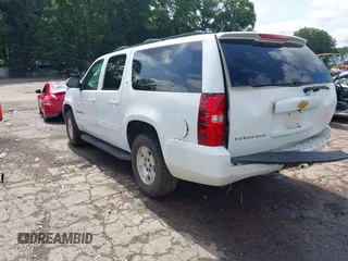 2014 Chevrolet Suburban LT with VIN 1GNSCJE07ER211222, listed as a IAAI auction lot 42428084 with 214,712 mi miles and . Bid and sale history available at DreamBid. Image 3.