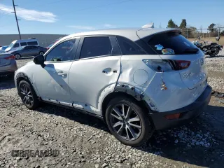 2018 Mazda CX-3 Touring with VIN JM1DKFC71J1305316, listed as a Copart auction lot 88087095 with 68,279 mi miles and Salvage Title. Bid and sale history available at DreamBid. Image 2.