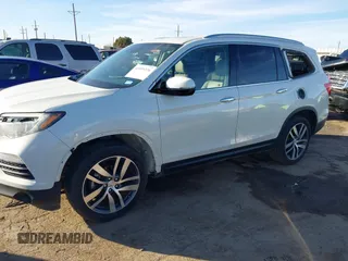 2017 Honda Pilot Touring with VIN 5FNYF6H93HB056387, listed as a IAAI auction lot 41095336 with 90,376 mi miles and . Bid and sale history available at DreamBid. Image 6.