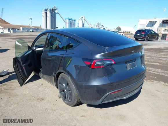 2025 Tesla Model Y Long Range with VIN 7SAYGDEE1SA351255, listed as a IAAI auction lot 41816235 with 1,463 mi miles. Bid and sale history available at carsss.com. Image 3.