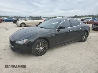 2014 Maserati Ghibli z VIN ZAM57XSAXE1128131, wystawiony jako Copart lot #87812895 z przebiegiem 74 079 mil mil oraz Szkody całkowita. Historia ofert i sprzedaży dostępna na DreamBid. Obrazek 1.