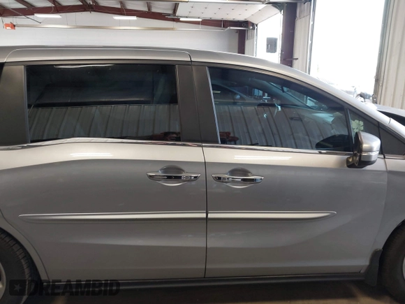 2018 Honda Odyssey EX-L z VIN 5FNRL6H70JB059653, wystawiony jako IAAI lot #42324330 z przebiegiem 115 623 mil mil oraz . Historia ofert i sprzedaży dostępna na DreamBid. Obrazek 14.
