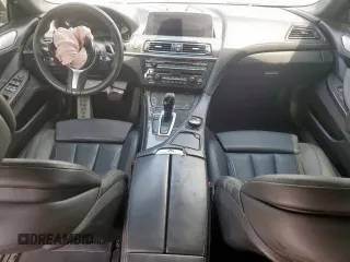 2018 BMW 6 Series 650i z VIN WBA6D4C59JD981398, wystawiony jako Copart lot #53455655 z przebiegiem 19 752 mil mil oraz Szkody całkowita. Historia ofert i sprzedaży dostępna na DreamBid. Obrazek 8.