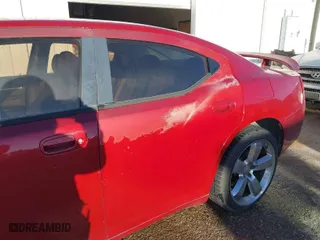 2009 Dodge Charger SXT with VIN 2B3KA33V39H544372, listed as a IAAI auction lot 41712170 with 146036 miles. Bid and sale history available at carsss.com. Image 6.