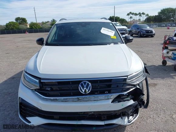 2023 Volkswagen Tiguan SE R-Line Black with VIN 3VVCB7AX0PM090710, listed as a IAAI auction lot 41256904 with 12,819 mi miles. Bid and sale history available at carsss.com. Image 12.
