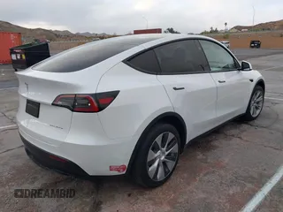2023 Tesla Model Y Long Range with VIN 7SAYGDEE2PF874729, listed as a IAAI auction lot 41518376 with 10,927 mi miles and . Bid and sale history available at DreamBid. Image 4.