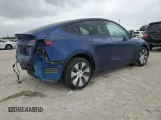 2023 Tesla Model Y Long Range z VIN 7SAYGDEE5PF787794, wystawiony jako Copart lot #55212605 z przebiegiem 30 277 mil mil oraz Szkoda całkowita • Salvage title. Historia ofert i sprzedaży dostępna na DreamBid. Obrazek 3.