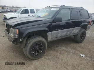 1998 Jeep Grand Cherokee Laredo with VIN 1J4GZ58S2WC281923, listed as a Copart auction lot 44010885 with 210,959 mi miles and Salvage Title. Bid and sale history available at carsss.com. Image 1.