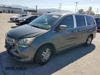 2007 Honda Odyssey EX-L with VIN 5FNRL387X7B103780, listed as a Copart auction lot 52159675 with 214,581 mi miles and Salvage Title. Bid and sale history available at carsss.com. Image 1.