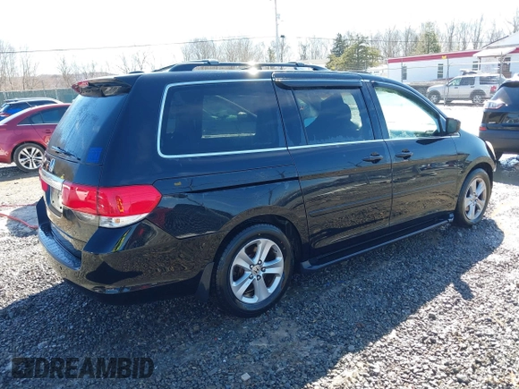 2008 Honda Odyssey Touring with VIN 5FNRL38948B029193, listed as a IAAI auction lot 41618424 with 219,964 mi miles. Bid and sale history available at carsss.com. Image 4.