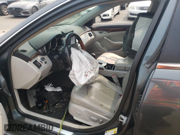 2011 Cadillac CTS Premium z VIN 1G6DS5ED1B0154694, wystawiony jako Copart lot #59187255 z przebiegiem Nie podano mil oraz Szkoda całkowita • Salvage title. Historia ofert i sprzedaży dostępna na DreamBid. Obrazek 7.