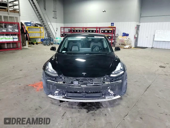 2019 Tesla Model 3 Mid Range z VIN 5YJ3E1EA4KF310792, wystawiony jako Copart lot #53031595 z przebiegiem 99 799 mil mil oraz Szkody całkowita. Historia ofert i sprzedaży dostępna na DreamBid. Obrazek 14.