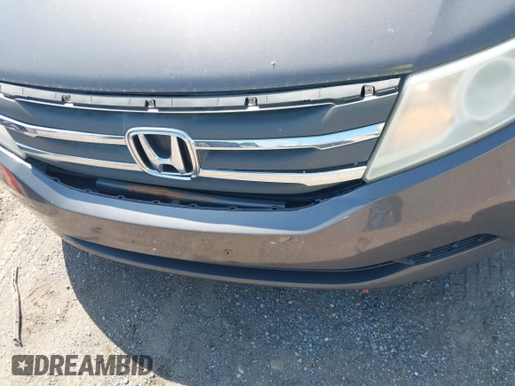 2013 Honda Odyssey EX-L with VIN 5FNRL5H65DB011071, listed as a IAAI auction lot 41992265 with 192,624 mi miles and . Bid and sale history available at DreamBid. Image 6.