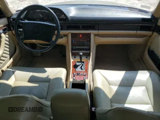 1991 Mercedes-Benz 560 with VIN WDBCA39E9MA599487, listed as a Copart auction lot 51921915 with 59,132 mi miles and Salvage Title. Bid and sale history available at DreamBid. Image 8.