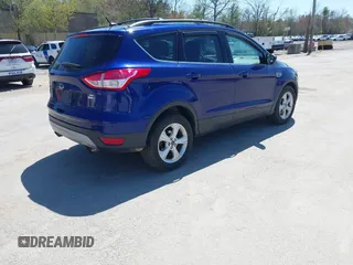2016 Ford Escape SE with VIN 1FMCU9GX1GUB28870, listed as a IAAI auction lot 42129628 with 113,909 mi miles. Bid and sale history available at carsss.com. Image 4.