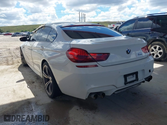 2014 BMW M6 z VIN WBS6C9C50EDV73809, wystawiony jako IAAI lot #41648991 z przebiegiem 68 054 mil mil oraz . Historia ofert i sprzedaży dostępna na DreamBid. Obrazek 3.