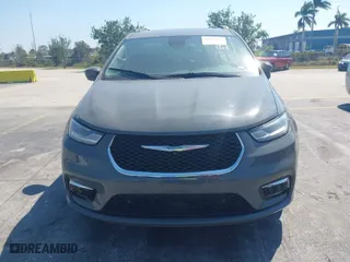 2021 Chrysler Pacifica Hybrid Touring L with VIN 2C4RC1L7XMR586201, listed as a IAAI auction lot 41859340 with 55,906 mi miles. Bid and sale history available at carsss.com. Image 12.