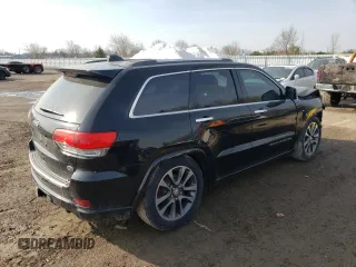 2018 Jeep Grand Cherokee Overland with VIN 1C4RJFCG8JC262591, listed as a Copart auction lot 47814985 with 135,542 mi miles and Salvage Title. Bid and sale history available at carsss.com. Image 3.