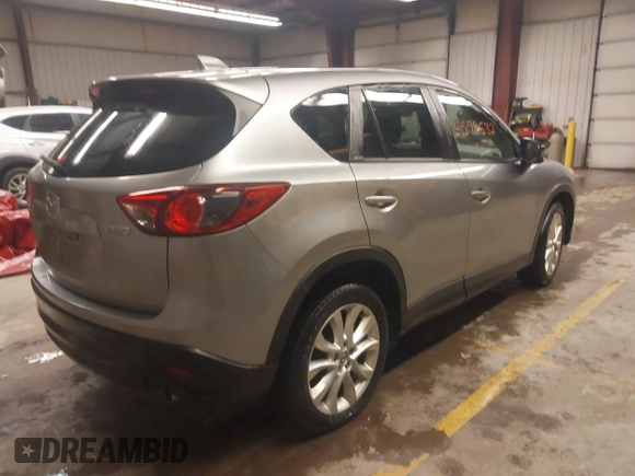 2014 Mazda CX-5 Grand Touring with VIN JM3KE4DY5E0305882, listed as a IAAI auction lot 41879532 with 173,443 mi miles. Bid and sale history available at carsss.com. Image 4.