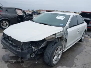 2014 Volkswagen Passat TDI SEL Premium with VIN 1VWCN7A32EC035738, listed as a IAAI auction lot 41641843 with 151,159 mi miles. Bid and sale history available at carsss.com. Image 2.