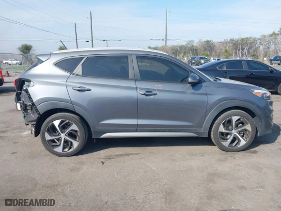 2017 Hyundai Tucson Value with VIN KM8J33A24HU281183, listed as a IAAI auction lot 41563886 with 71,110 mi miles. Bid and sale history available at carsss.com. Image 13.