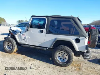 2005 Jeep Wrangler Unlimited with VIN 1J4FA44SX5P316055, listed as a IAAI auction lot 41586898 with 218,181 mi miles. Bid and sale history available at carsss.com. Image 14.