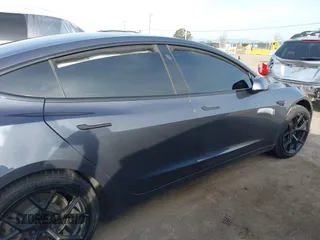 2019 Tesla Model 3 Long Range with VIN 5YJ3E1EB6KF413320, listed as a IAAI auction lot 41760428 with 90,441 mi miles and . Bid and sale history available at DreamBid. Image 12.