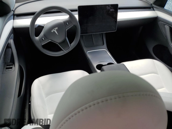 2024 Tesla Model Y Long Range with VIN 7SAYGDEE4RA285620, listed as a Copart auction lot 57883015 with 18,841 mi miles and Salvage title. Bid and sale history available at DreamBid. Image 8.